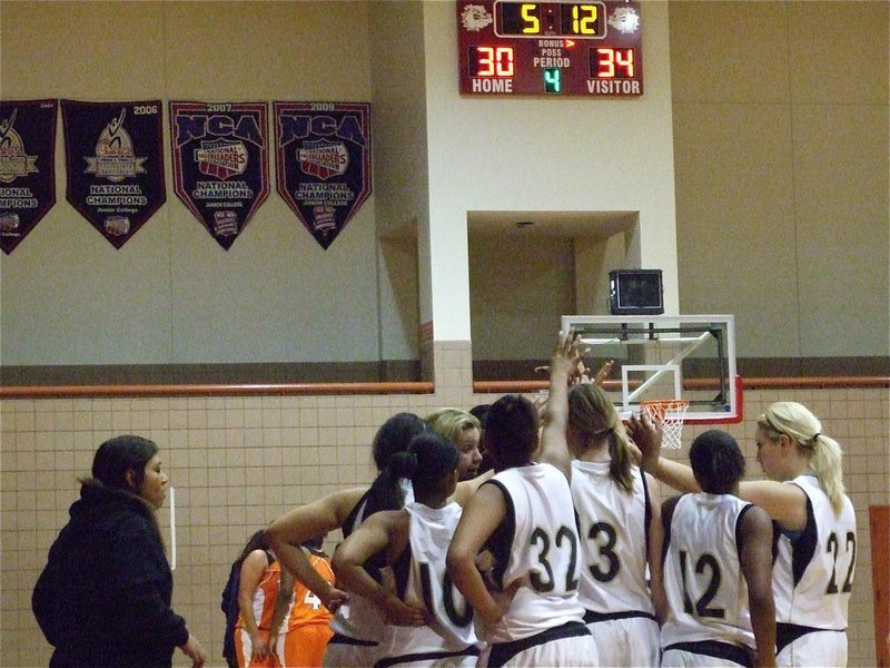 Image: Rally time — After battling back from 7-points down to take the lead 30-29, Coach Stacy McDonald tries to motivate the team after falling behind by 4-points midway through the 4th.