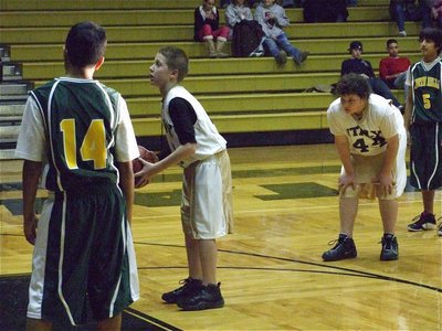 Image: Escamilla at the stripe — 7th grade point guard J.T. Escamilla(12) makes a point from the free throw line early in the game.