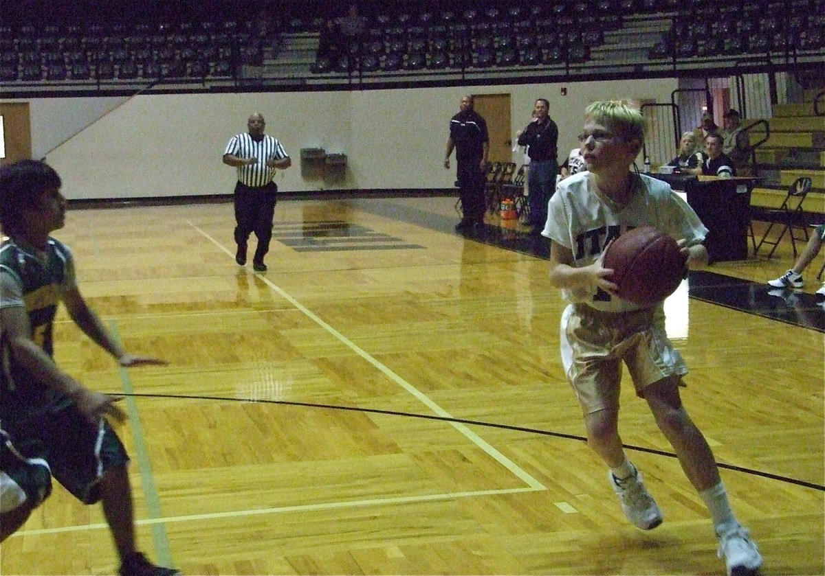 Image: Boyd pushes the ball — Italy’s Cody Boyd looks for an opening against irving North Hills.