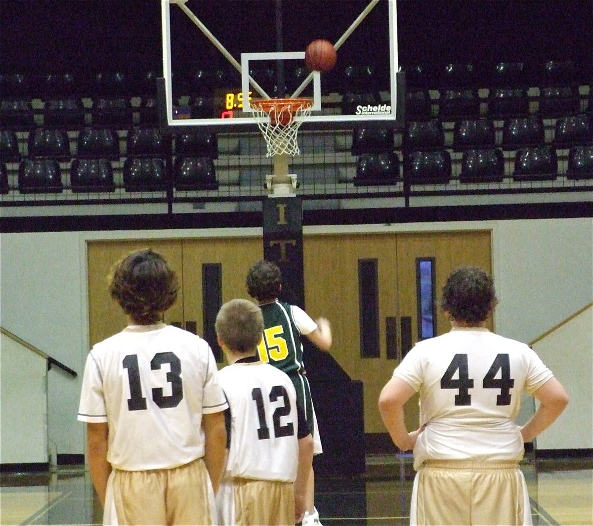 Image: Let’s get technical — Chace McGinnis(13), J.t. Escamilla(12) and John Byers(44) watch Irving North Hills shoot technical foul shots in the second half.