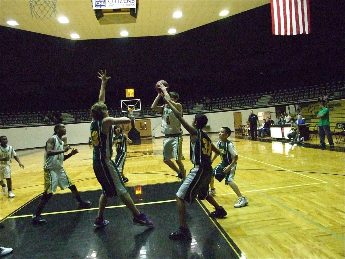 Image: Wood shoots — Justin Wood(4) pulls up for two more points.