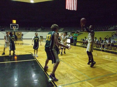 Image: Baseline jump shot — Treyvon Robertson(15) shoots from the left wing.
