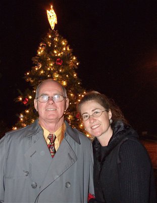 Image: Ronnie and Ronda — Pastor Ronnie Dabny and his precious daughter, Ronda Cockerham, take a moment to bask in the glow of the brightly lit Christmas tree on Main Steet in downtown Italy.