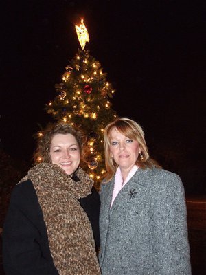 Image: Clover and Janet — Clover Stiles and Janet Campbell add to the beauty of the Christmas tree after the tree lighting ceremony.