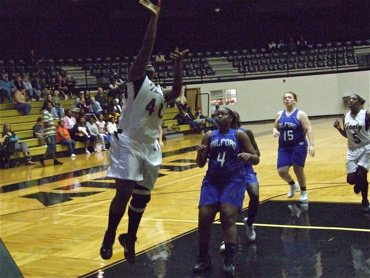 Image: Reed scores easy — Italy center Jimesha Reed leads the fast break.