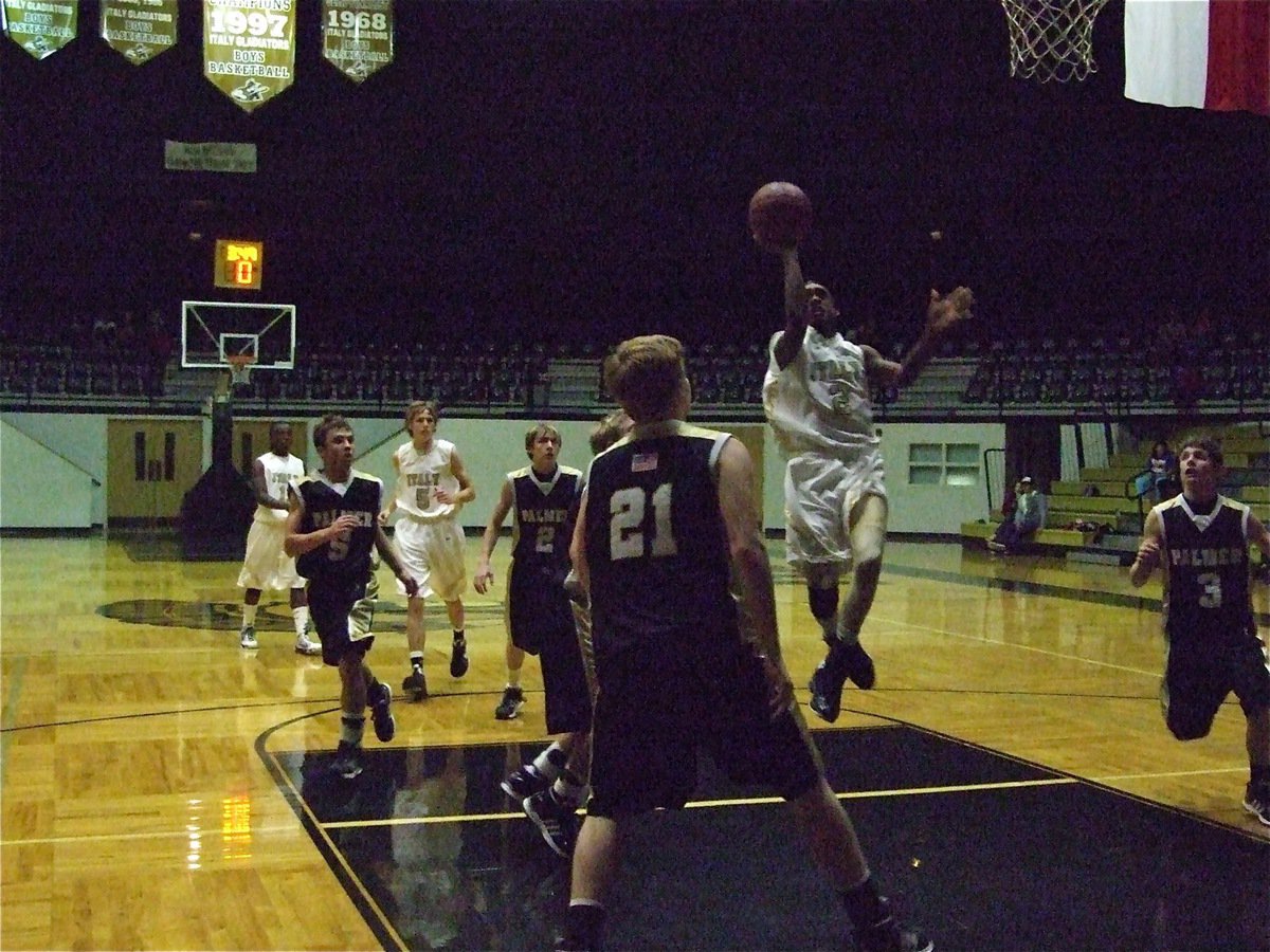 Image: Heath up the middle — Clemons climbs on air and over the Bulldog defense.