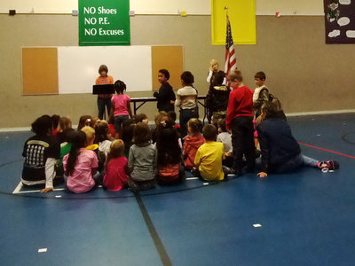 Image: Kindergartners Being Honored — The Kindergartners standing up turned in all their homework for the last six weeks.