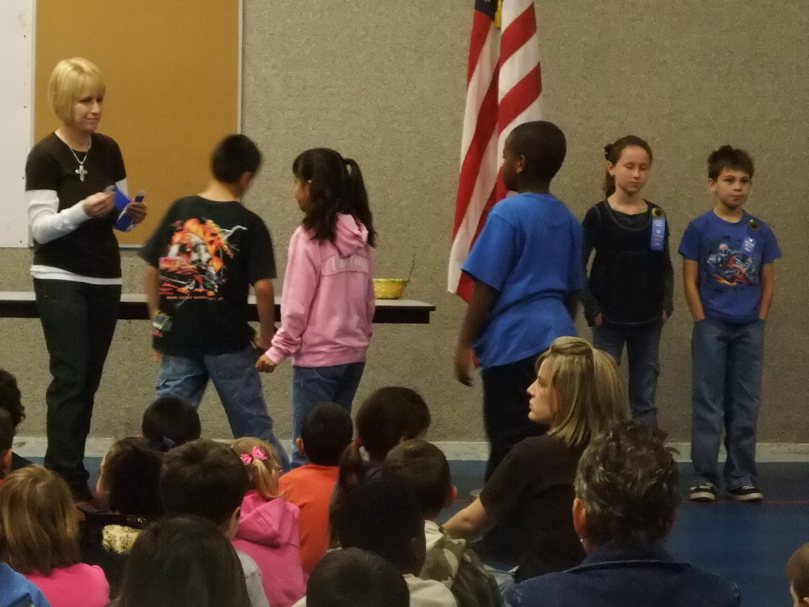 Image: Handing Out Awards — Lisa Jacinto was kept busy handing out many ribbons.