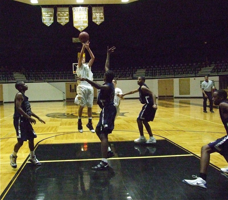 Image: Holden hits a jumper — Despite being in foul trouble early, Jase Holden(4) managed 15-points in the Italy JV game against Dallas Life.