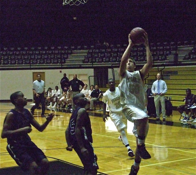 Image: Jackson steps up — Kyle Jackson(50) put in 10-points of his own to help the Italy JV’s cause.