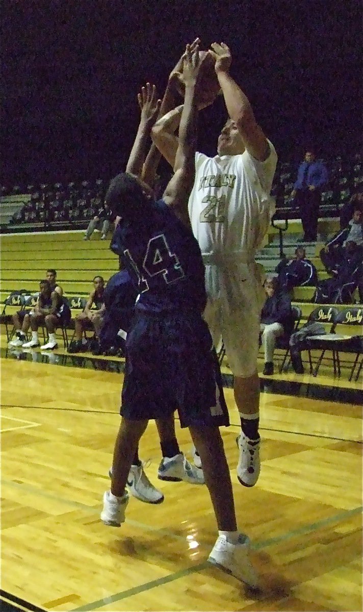 Image: Saxon shoots at Lions — Ethan Saxon gets smothered as he takes aim against the Lions.