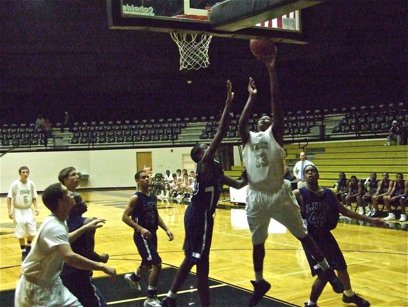 Image: King of the paint — JV Gladiator Larry Mayberry(13) banks in 2 of his 16-points against Dallas Life.