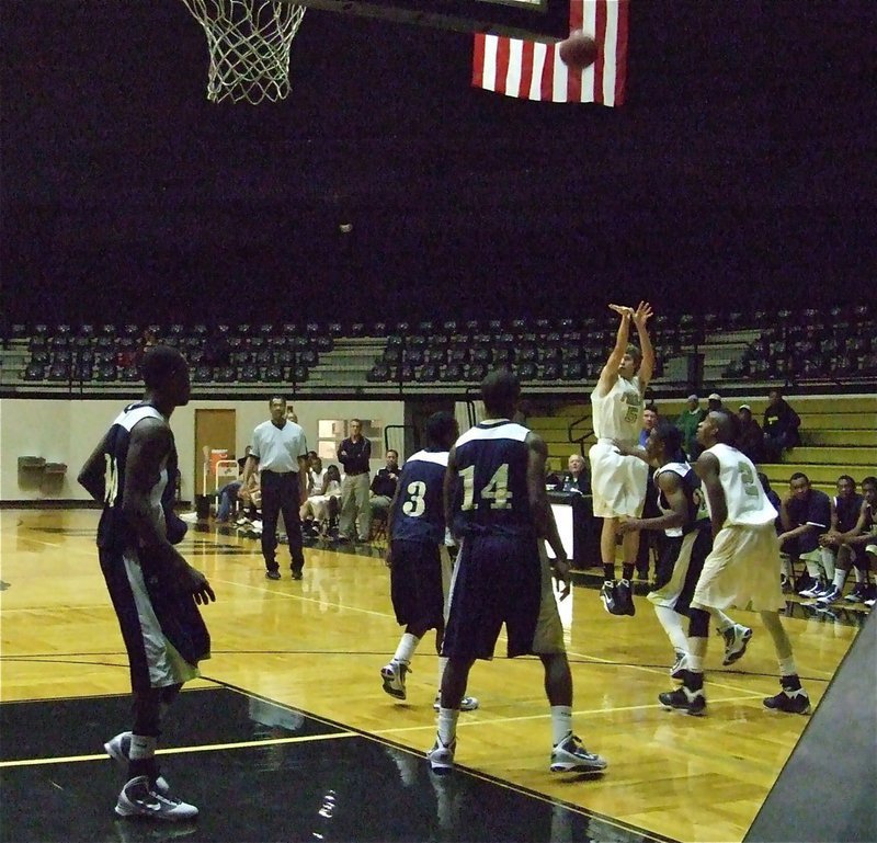 Image: Colton scopes one — Long-range sniper, Colton Campbell(5), knocks down 2 of his 9-points over a pack of Lions. Campbell also made 4-of-4 from the free throw line.