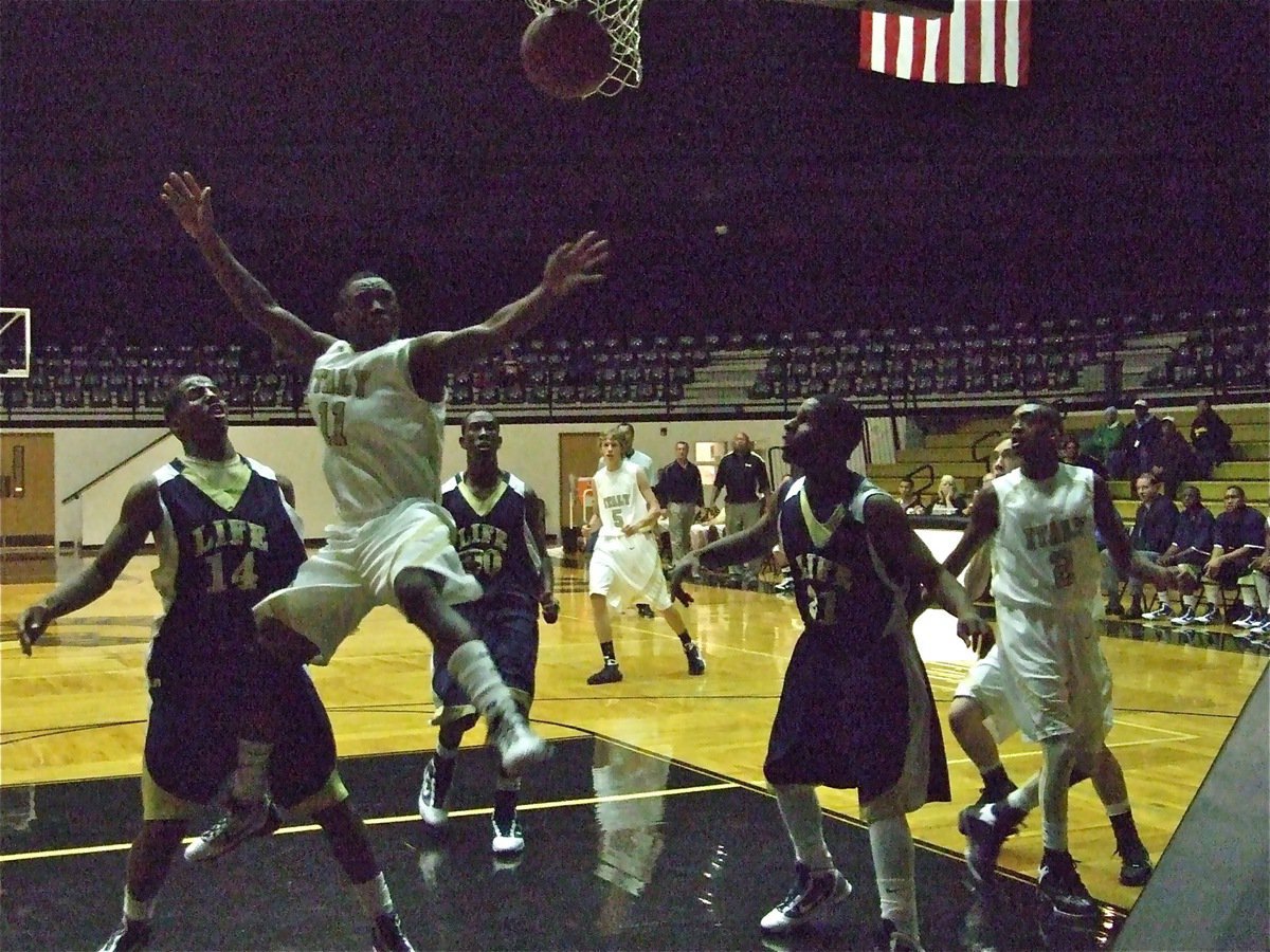 Image: Lions foul the “Beast” — Jasenio Anderson(11) gets mauled by a Dallas Life Lion on his way to the basket.