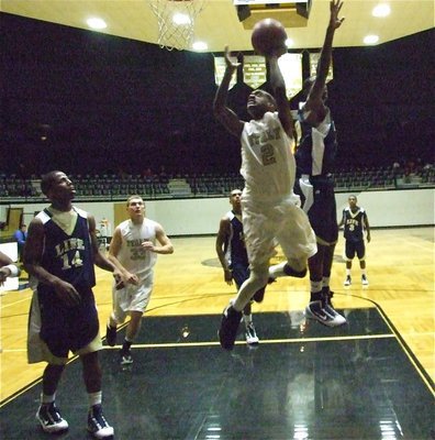 Image: Heath hangs in there — Heath Clemons(2) flies in for two of his 12-points.
