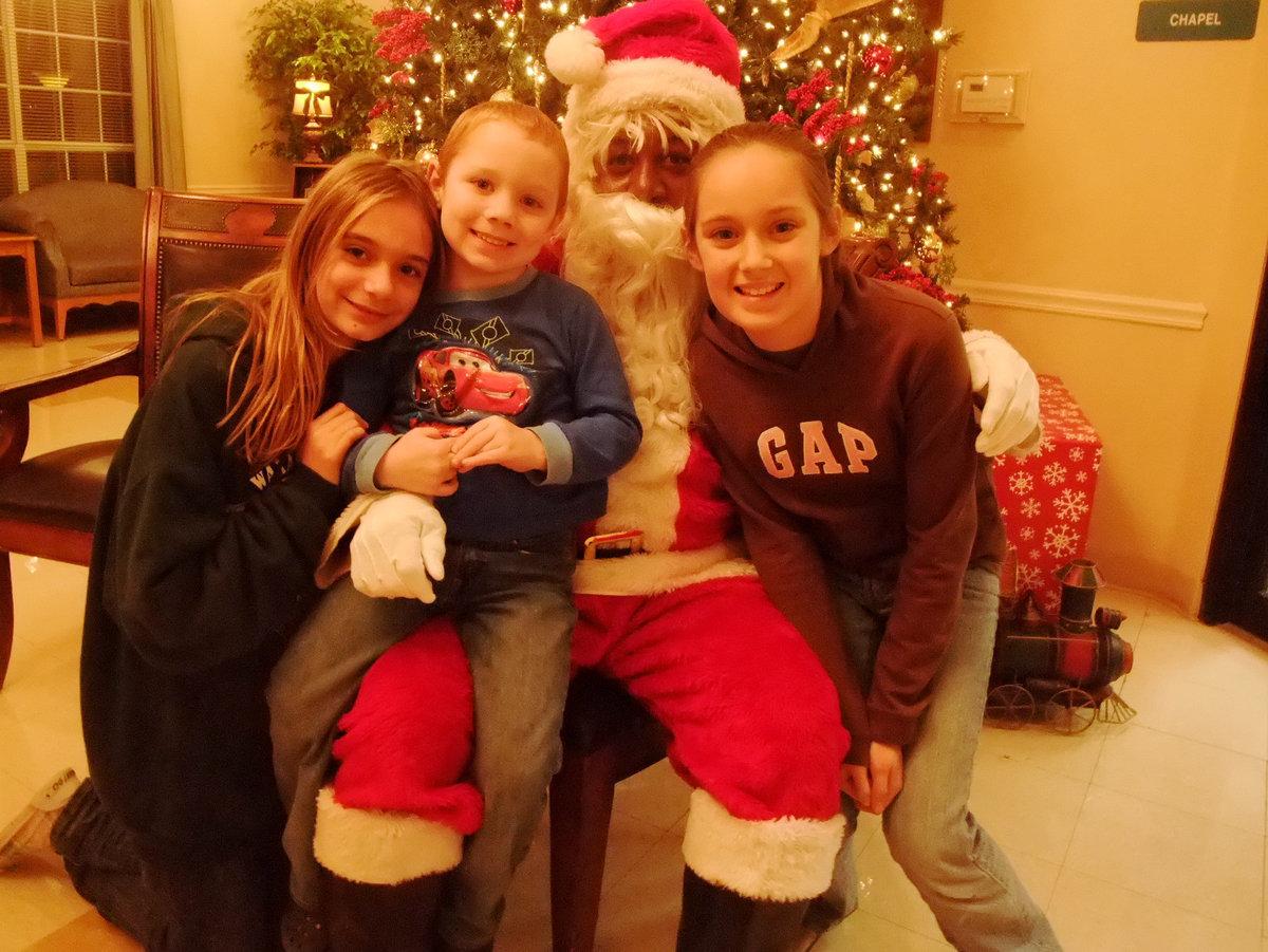 Image: Santa and Friends — Trinity Mission’s Christmas Open House welcomed the community to visit Santa, Buddy the Elf and residents.