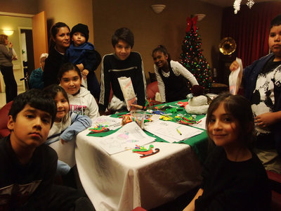 Image: Fun Time Crafts — These children were having fun making ornaments and writing letters to Santa.