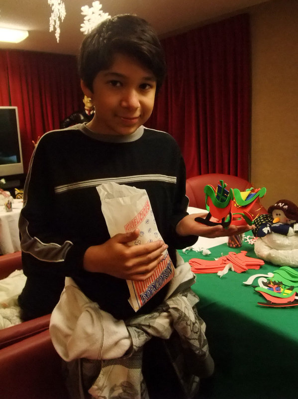 Image: Great Hand Crafted Ornament — He was having fun eating popcorn and making a beautiful ornament.