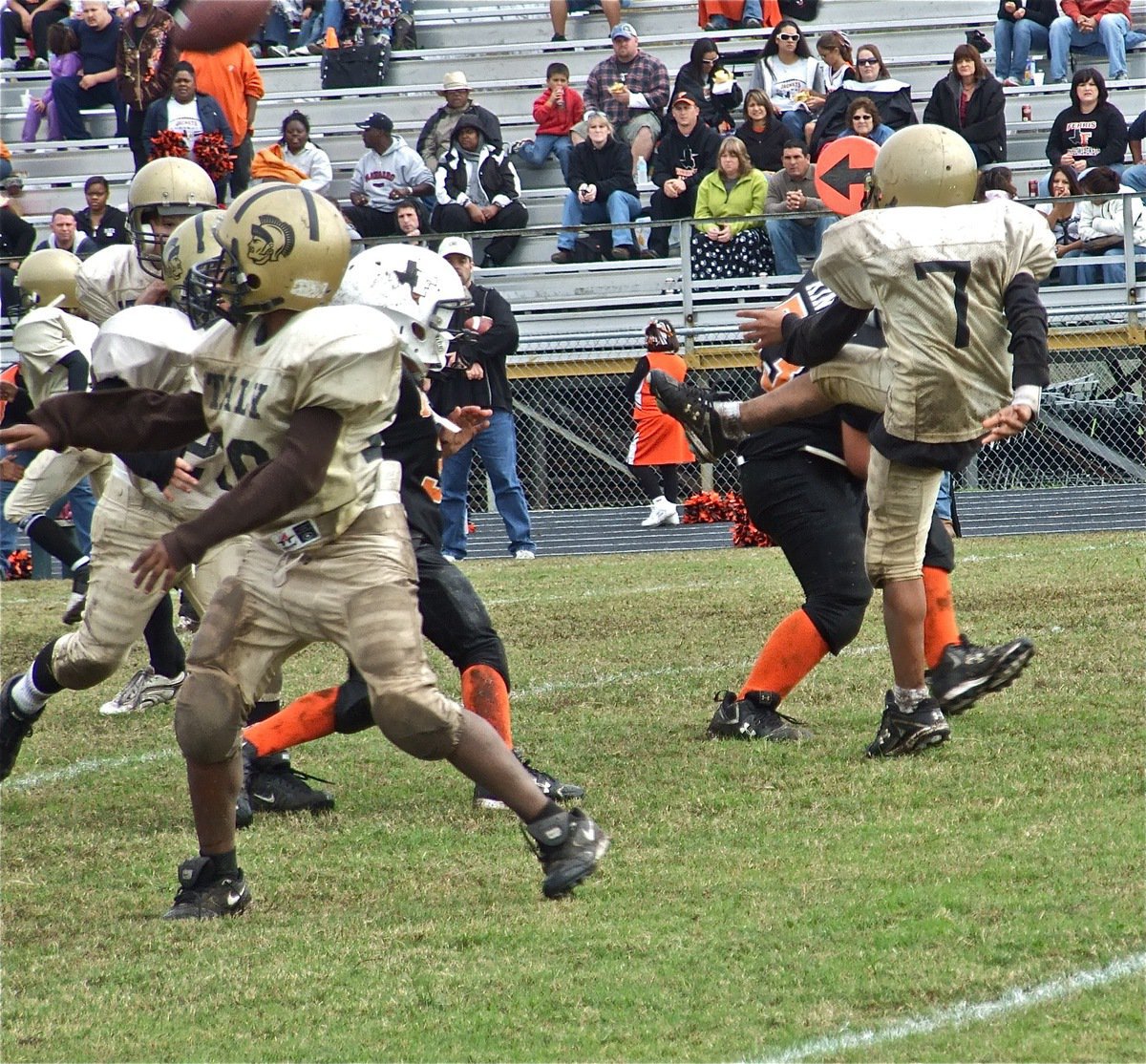 Image: Clutch Kick — Tylan Wallace(7) avoids a Ferris defender and gets the punt away.