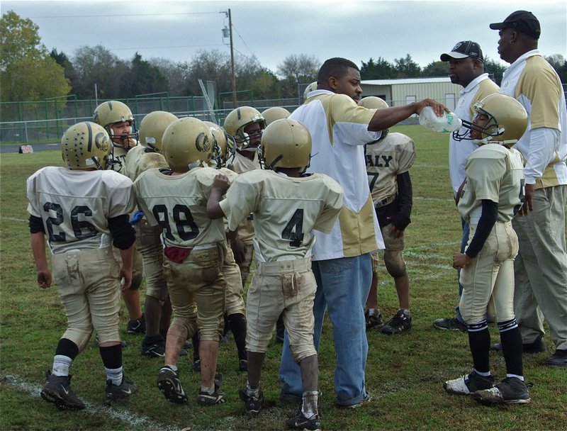 Image: Rest a second — The B-Team coaches water their troops during a timeout.