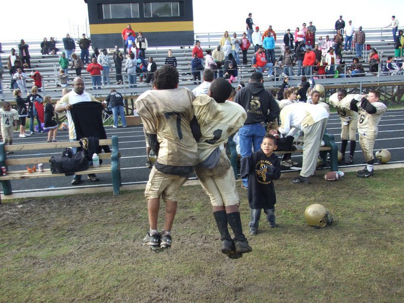 Image: Jump for joy — Tylan Wallace(7) and Kendrick Norwood(1) jump for joy after beating Ferris in the Superbowl.