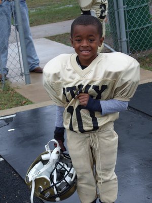 Image: Darrin is a Champion — Kindergartener Darrin Jackson(10) left the Superbowl feeling 2 inches taller after his IYAA C-Team Gladiators defeated the Palmer Bulldogs 18-0.