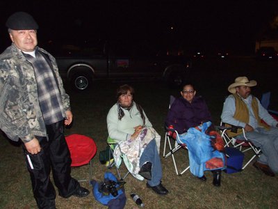 Image: Good times — The Gonzalez family and the Delahoya family relax while enjoying the IYAA bonfire.