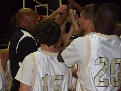 Image: Everybody in — Coach Larry Mayberry huddles his JV squad during their win over the Southwest Christian Eagles.