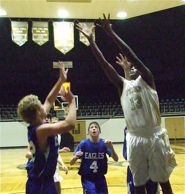 Image: Larry gets the rebound — Mayberry(13) crashes the boards.