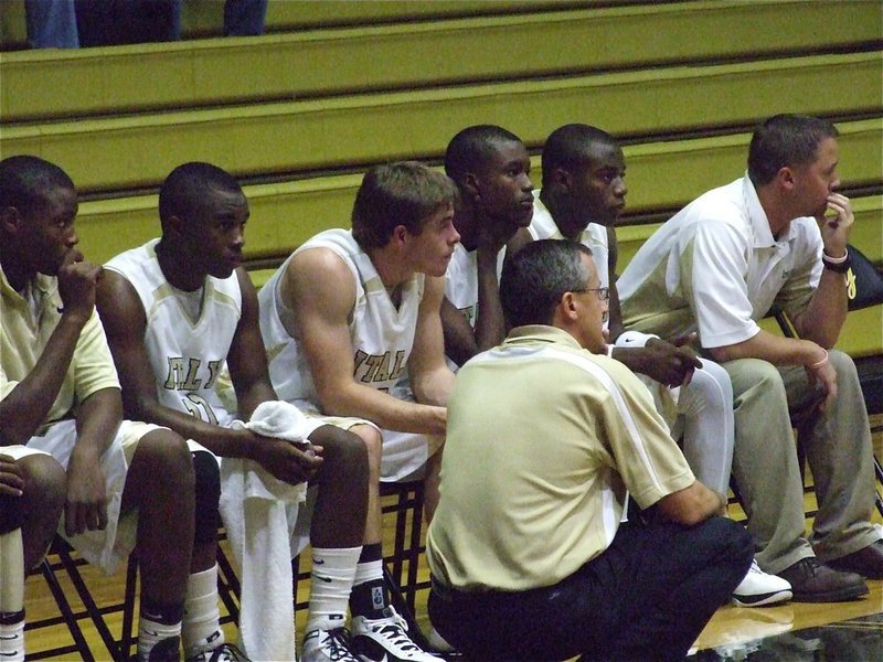 Image: Coach Holley observes — Coaches Kyle Holly and Josh Ward observe the action on the floor.