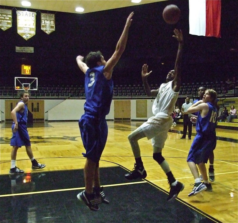 Image: Clemons attacks — Heath sneaks into the paint for 2-points.