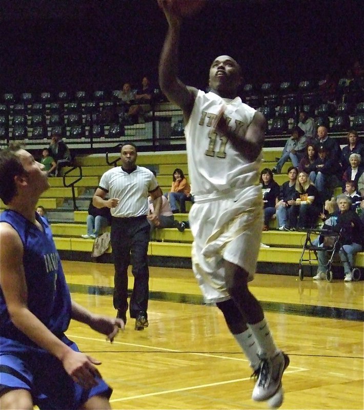 Image: Jasenio drives — Jasenio “Beast” Anderson(11) gets an easy bucket against the Eagles.