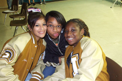 Image: Yesenia, Kyonne and Jameka  — IHS students are invited after the ball game.