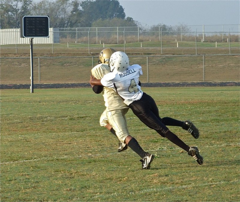 Image: Norwood catches — Ken Norwood, Jr. hauls in a pass against Palmer during A-Team’s 23-7 win.