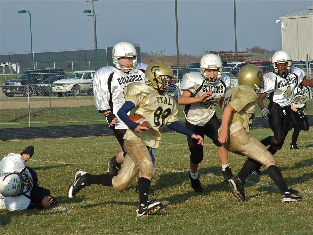 Image: Maynard gains ground — Quarterback Austin Maynard(82) follows battering ram, Isaac Salcido(80), through the middle of the Palmer defense.