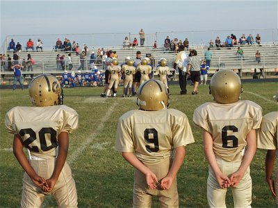 Image: Sideline view — The IYAA B-Team awaits the coin toss for their conference championship game against the Blooming Grove Lions.