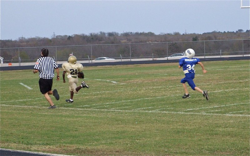 Image: Smith scores — Milford product, Taron Smith(21), helps his IYAA B-Team win the conference championship game over Blooming Grove.