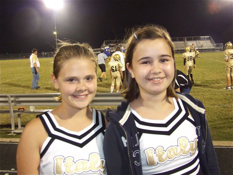 Image: Lillie and Amber — Lillie Perry and Amber Hooker kept their smiles all day and night as they cheered on the IYAA football teams.