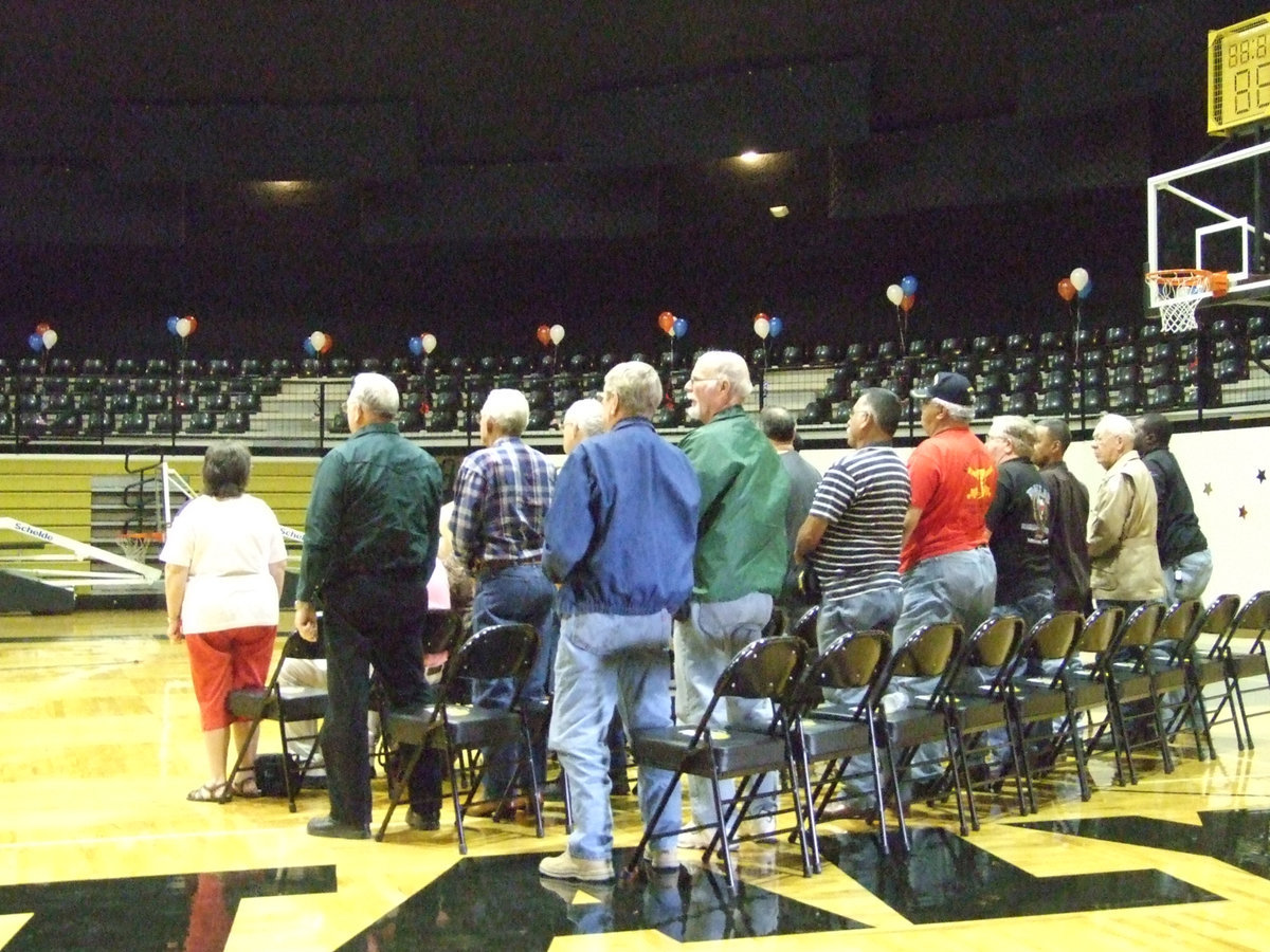 Image: Veterans stand — Our local veterans are still as loyal as they ever have been and still love their country very much.  Each stand for the “Pledge of Allegiance”.