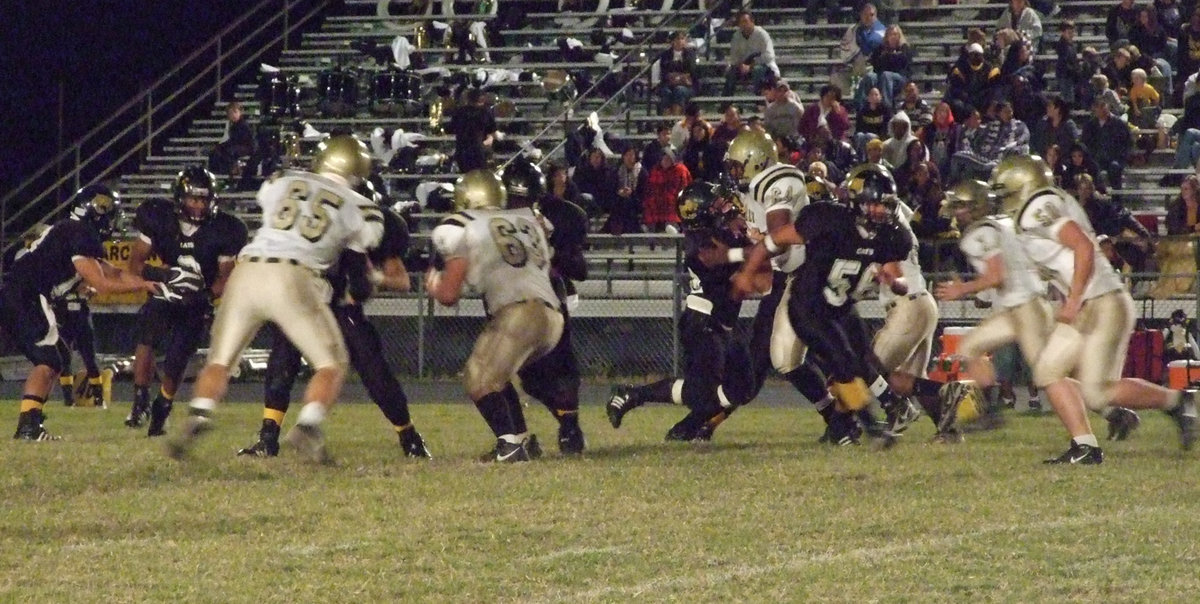 Image: Nowhere to hide — Jonathan Nash(65), Zach Hernandez(63), Bobby Wilson(64), Kyle Wilkins(7) and Ethan Simon(50) try to slow down Itasca’s speed backs.