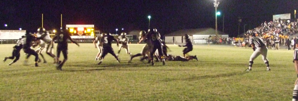 Image: Endzone battle — Jasenio Anderson runs the old “quarterback keeper” play toward Itasca’s endzone.