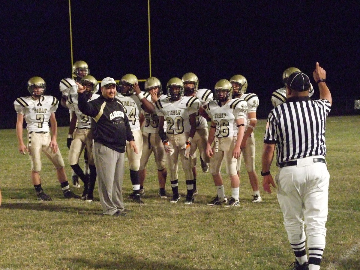 Image: Going toward Playoffs — The referee asks Coach Craig Bales which way is his team headed and Coach lets the ref know Italy’s headed to the playoffs. Italy will play Lovelady in Fairfield on Friday, November 13 starting at 7:30 p.m. – Go Gladiators!