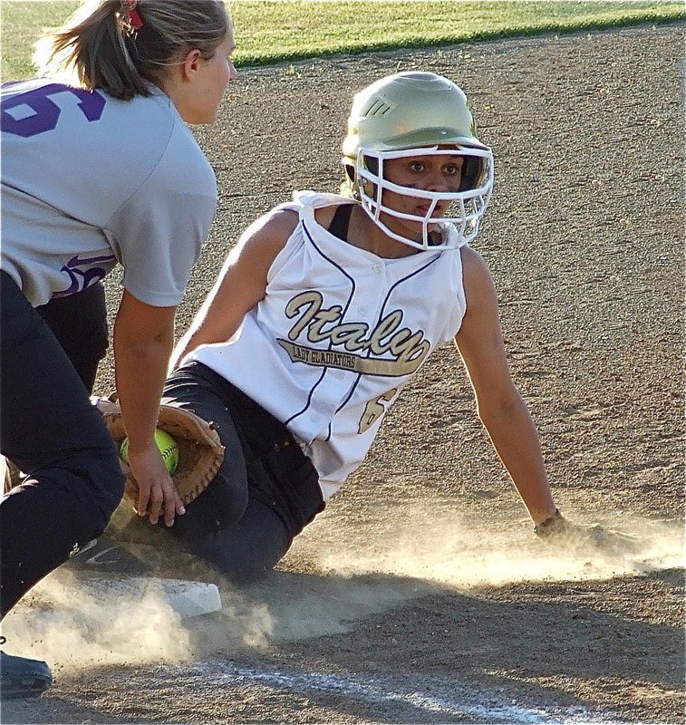 Image: Anna Viers and the Lady Gladiators slide past Tolar for area — Sliding into third base is Italy freshman, Anna Viers, who helped the Lady Gladiators win the area championship by defeating  the Tolar Lady Rattlers 7-0 in game one on Friday and with a dramatic rally to win game two on Saturday, 9-8.