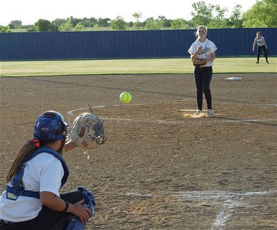 Image: Strike Three! — Courtney Westbrook pitches strike three to catcher Alyssa Richards late in game one against Tolar. Westbrook delivered a total of 9 strike three pitches on Friday.