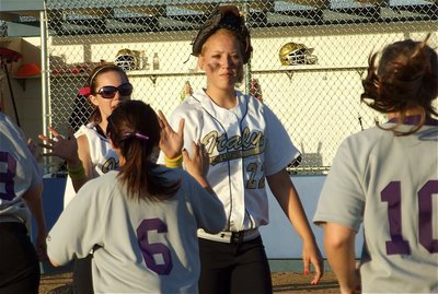 Image: Not over yet — Megan Richards and Drew Windham high-five the Lady Rattlers after Italy wins game one on Friday.