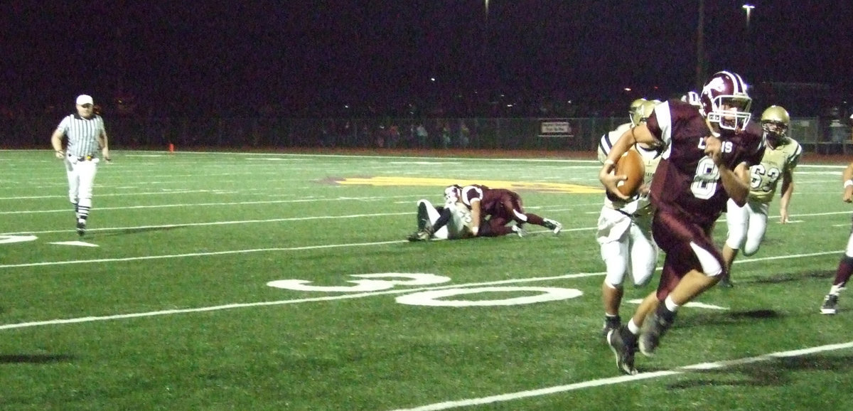 Image: Lions on the run — The Gladiators jumped out to a 14-0 lead but Lovelady quarterback #8 Jordy Denson and his offense eventually ran away with the game 52-21 as Ethan Simon(50) and Zachery Hernandez(63) tried to chase him down.