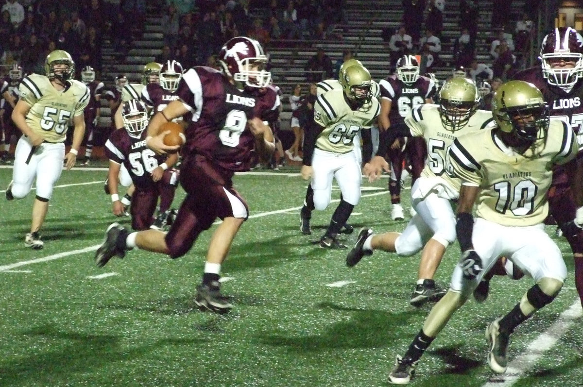 Image: Can’t cage the Lions — Lovelady’s #8 Jordy Denson gets into the endzone on another quarterback keeper while Gladiators’ Ross Enriquez(55), Jonathan Nash(65), Ethan Simon(50) and John Isaac(10) did their best to stop him.