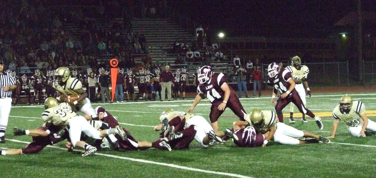 Image: Pass the syrup — #11 Jasenio Anderson keeps up the middle while his offensive line registers three pancake blocks on the play.