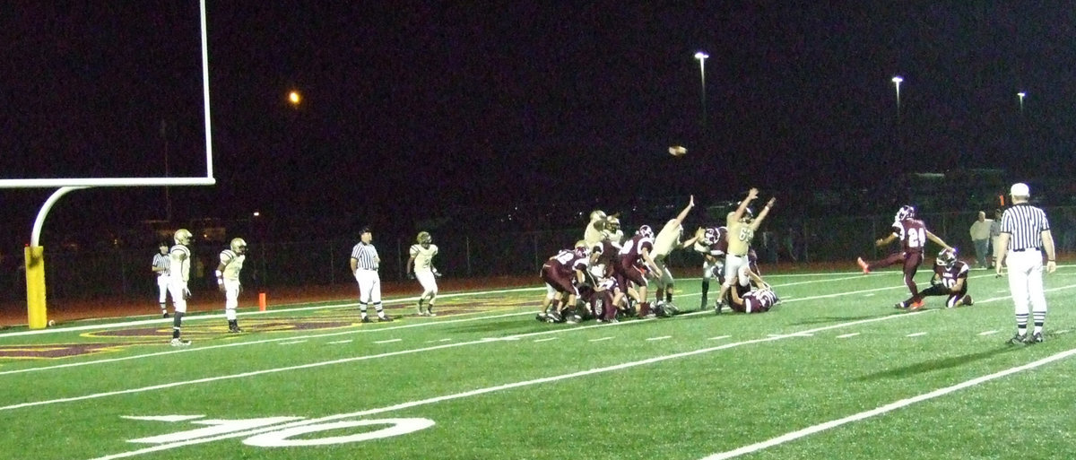 Image: Zach flattens a Lion — Italy’s Zach Hernandez(63) tries to block the Lion’s field goal attempt.