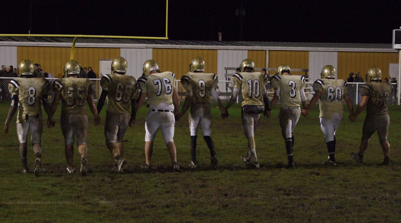 Image: The Last Walk — After a long and hard battle on Friday night against the Dawson Bulldogs, Gladiator Seniors walked the field one last time. Left to right: Desmond Anderson, Ross Enriquez, Jonathan Nash, Jeff Claxton, Aaron Thomas, John Isaac, Oscar Gonzalez, Ivan Roldan and Zachery Hernandez.